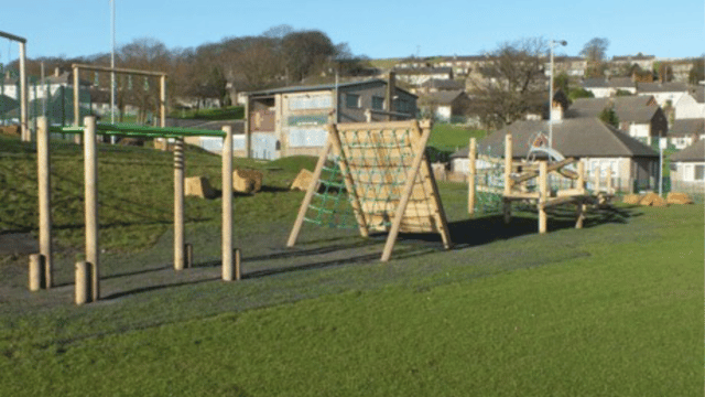 Wooden climbing frame on a playground area