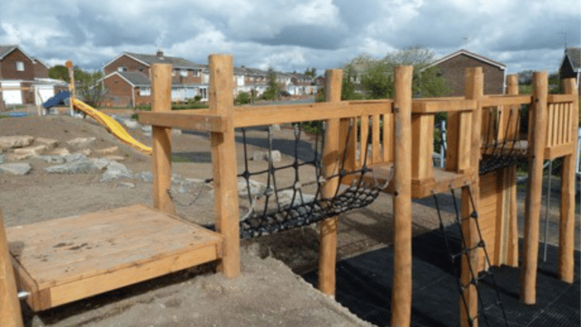 Wooden playground equipment built on housing estate