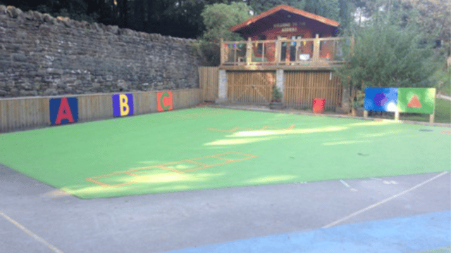 School playground with different coloured tarmac printed onto the floor